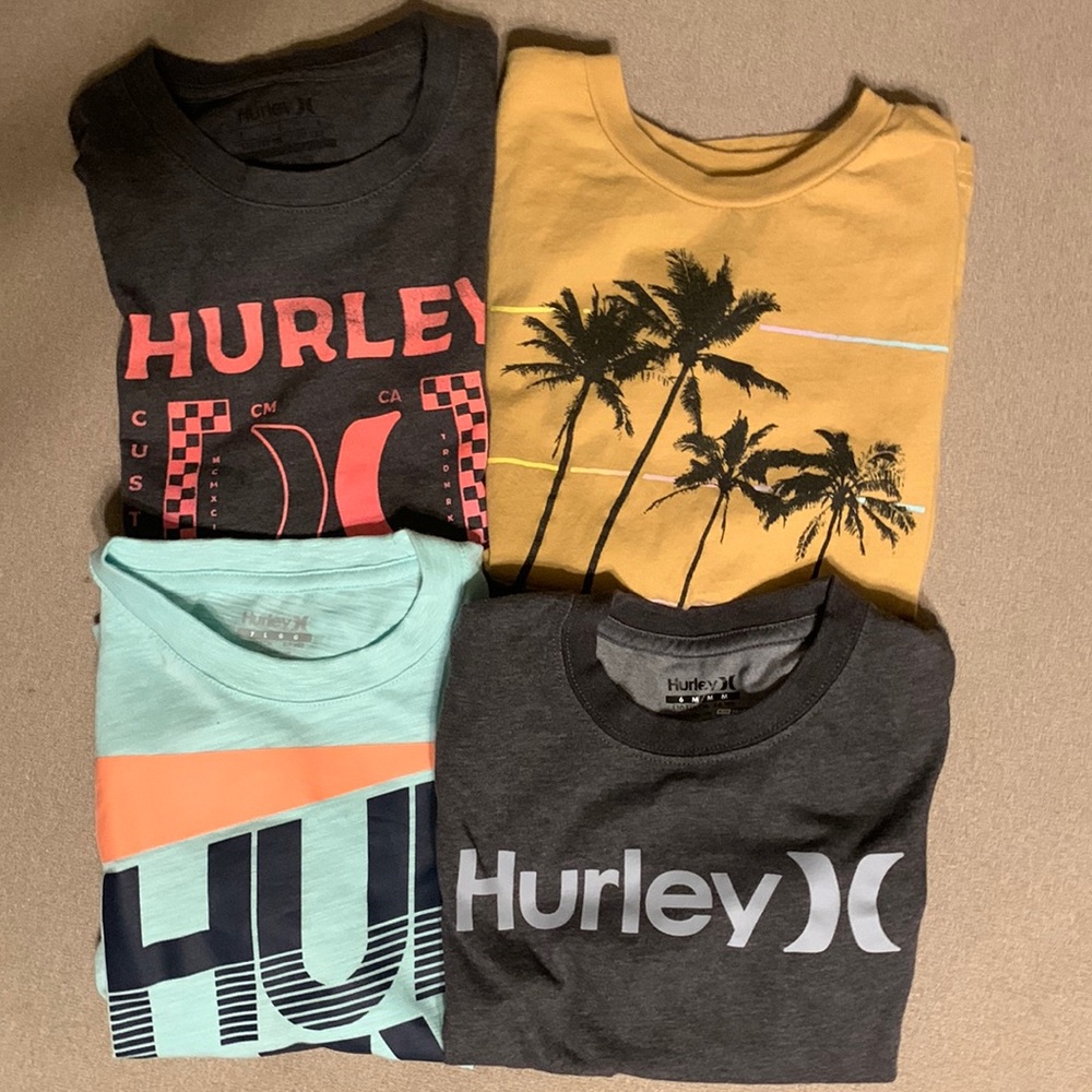 Lot of 4 boys short sleeved shirts.